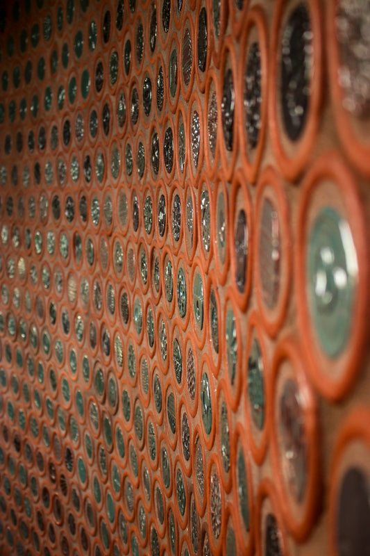 a close up of a wall made of circles