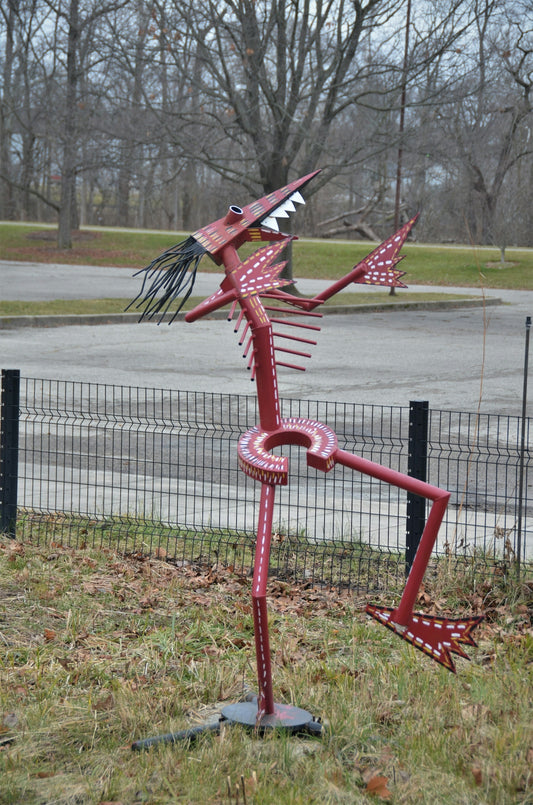 red metal stand on green grass field