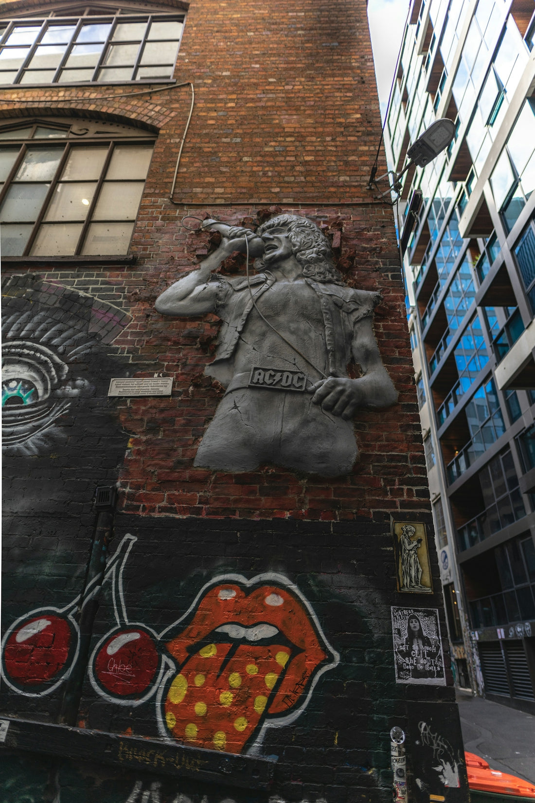 man sitting on microphone embossed artwork