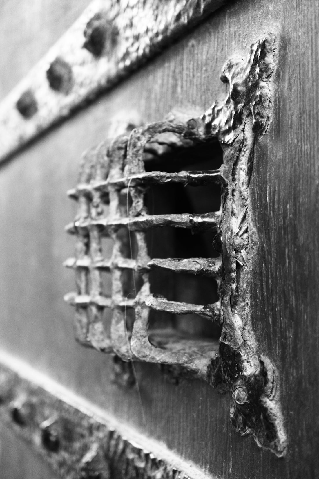 a close up of a metal object with holes in it