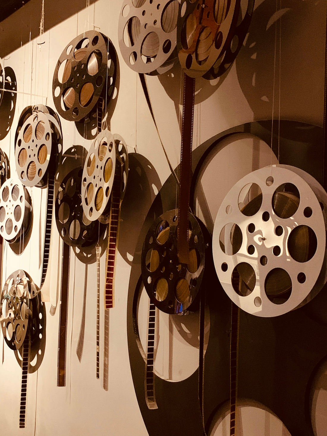 a bunch of clocks that are hanging on a wall
