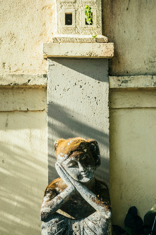 a statue of a baseball player holding a bat