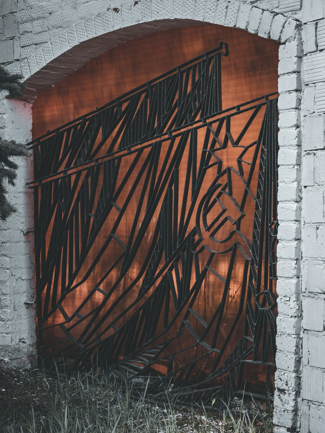a metal gate with a horse drawn on it