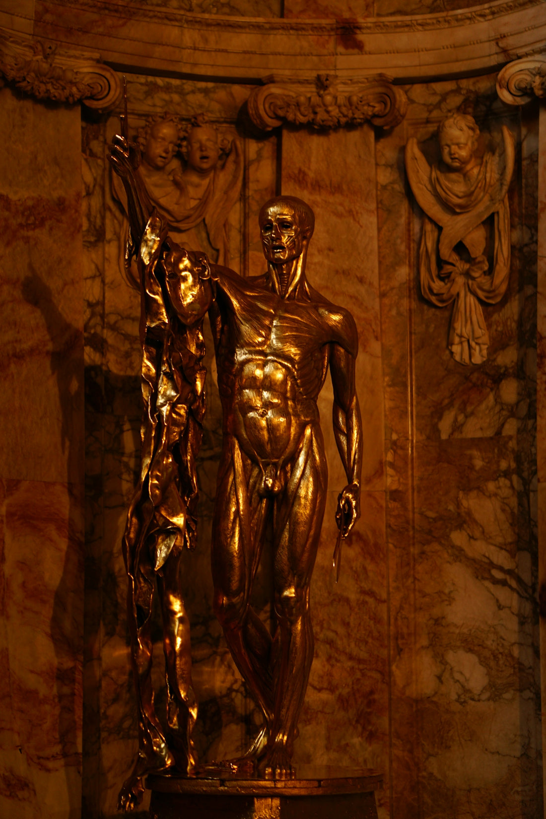 a statue of a man holding a woman's hand