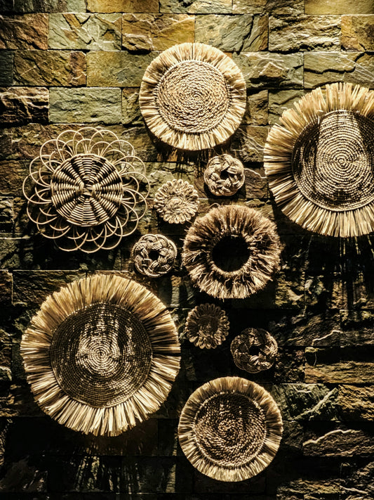 a group of plates sitting on top of a stone wall