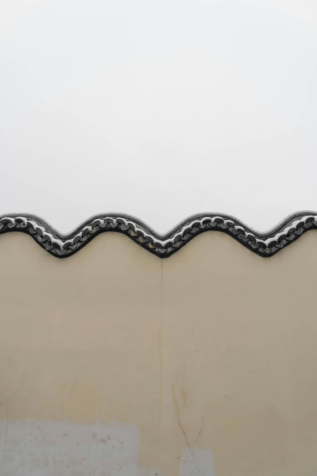 a close up of a metal roof with a white sky in the background