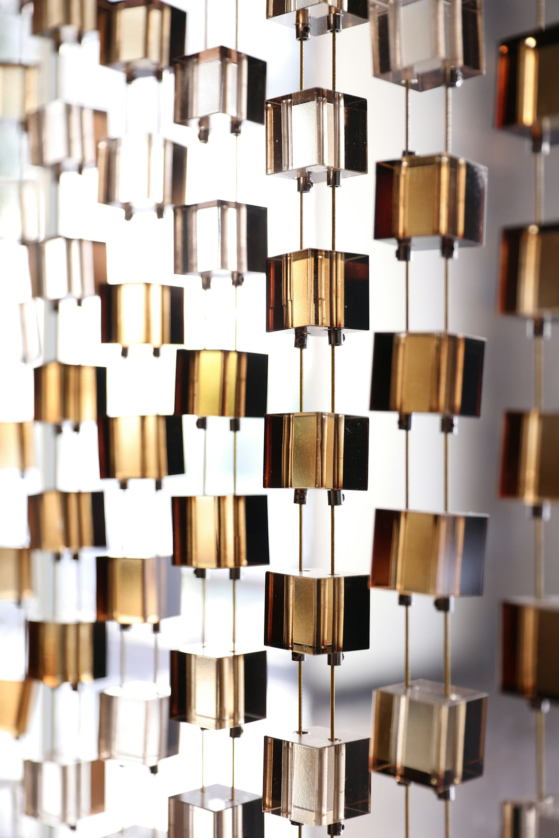 a close up of a cell phone hanging on a wall