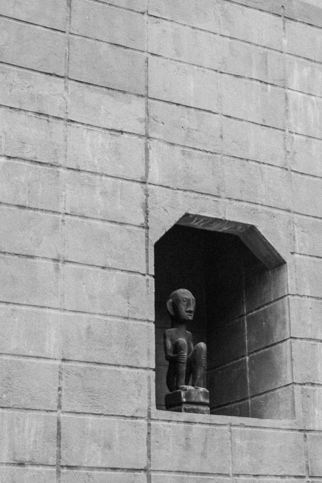 a black and white photo of a small window