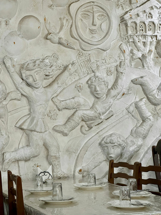 a white wall with a drawing of a man and a woman on it