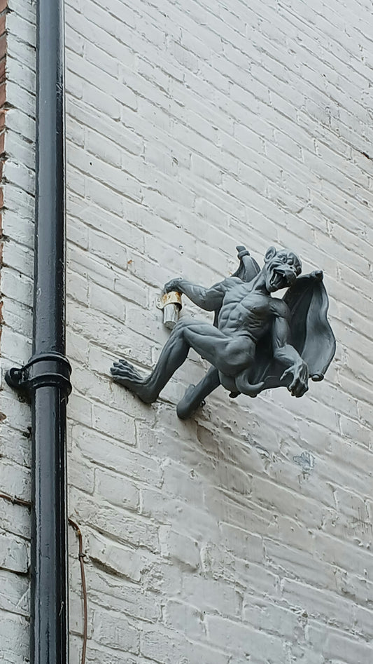 A statue on the side of a building