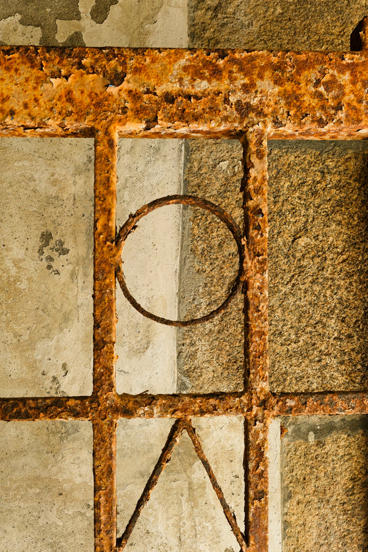 A close up of a metal object on a wall