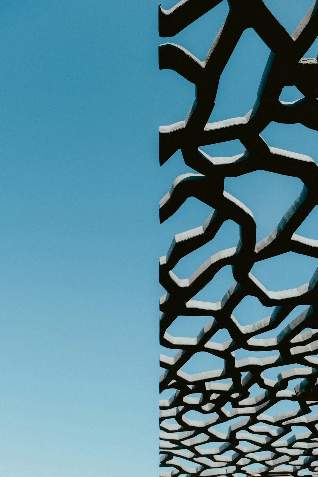 A tall building with a sky in the background