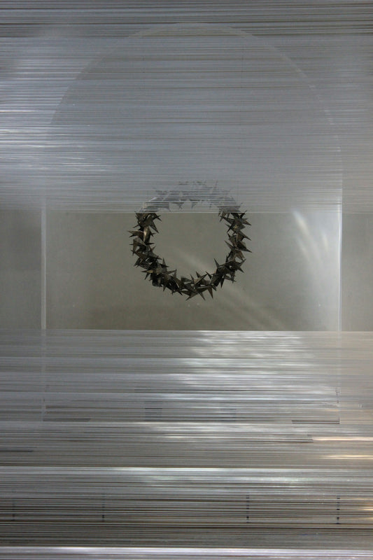A picture of a wreath hanging on a wall