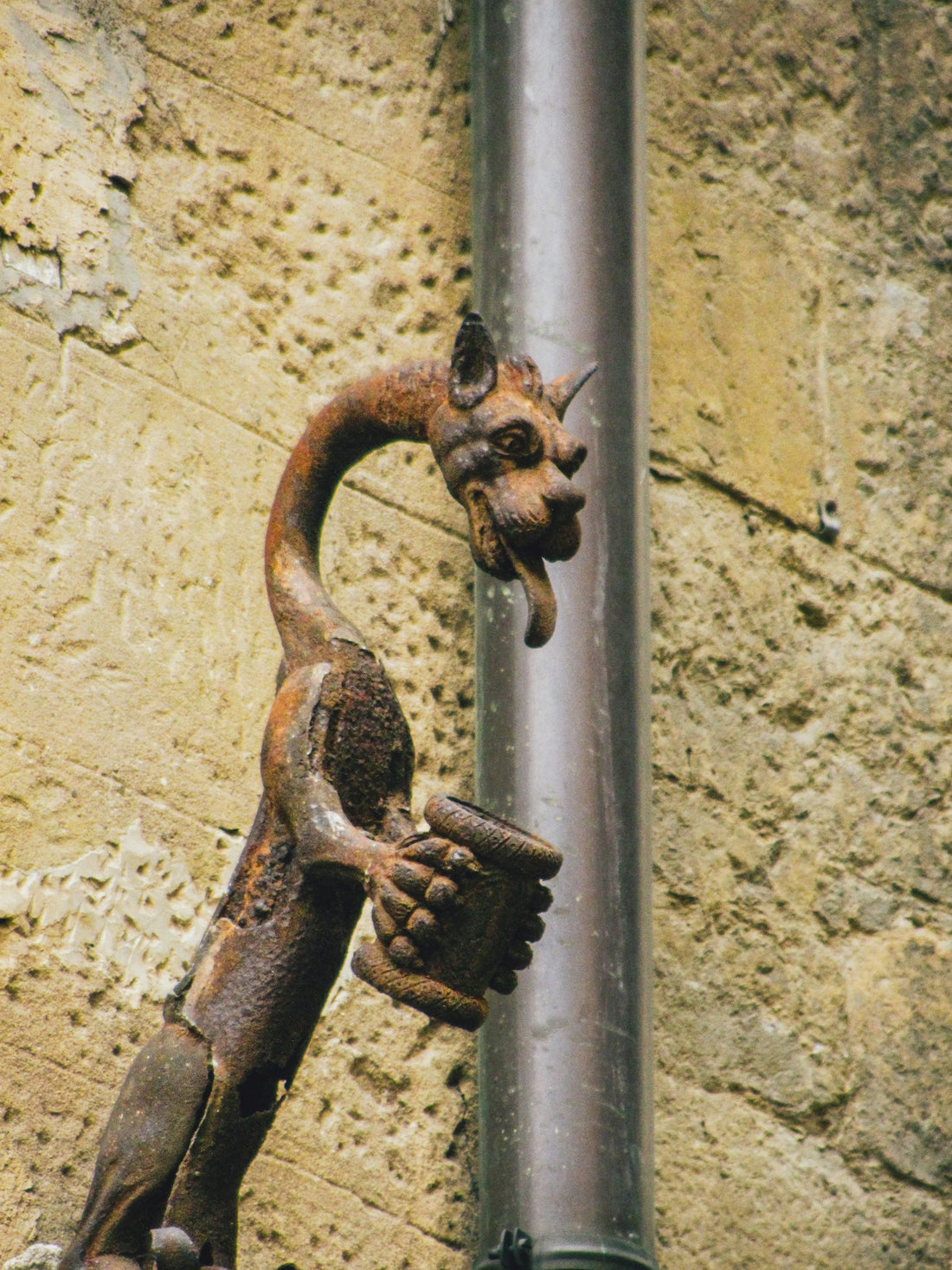 A close up of a metal object on a wall