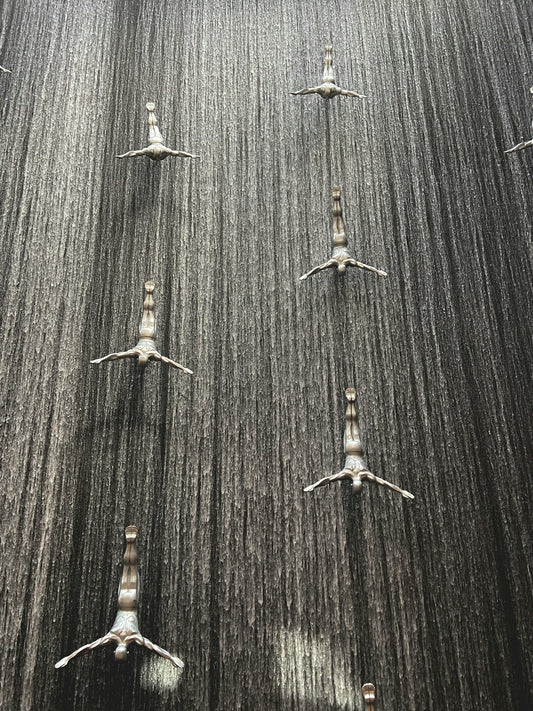 A group of birds standing on top of a field