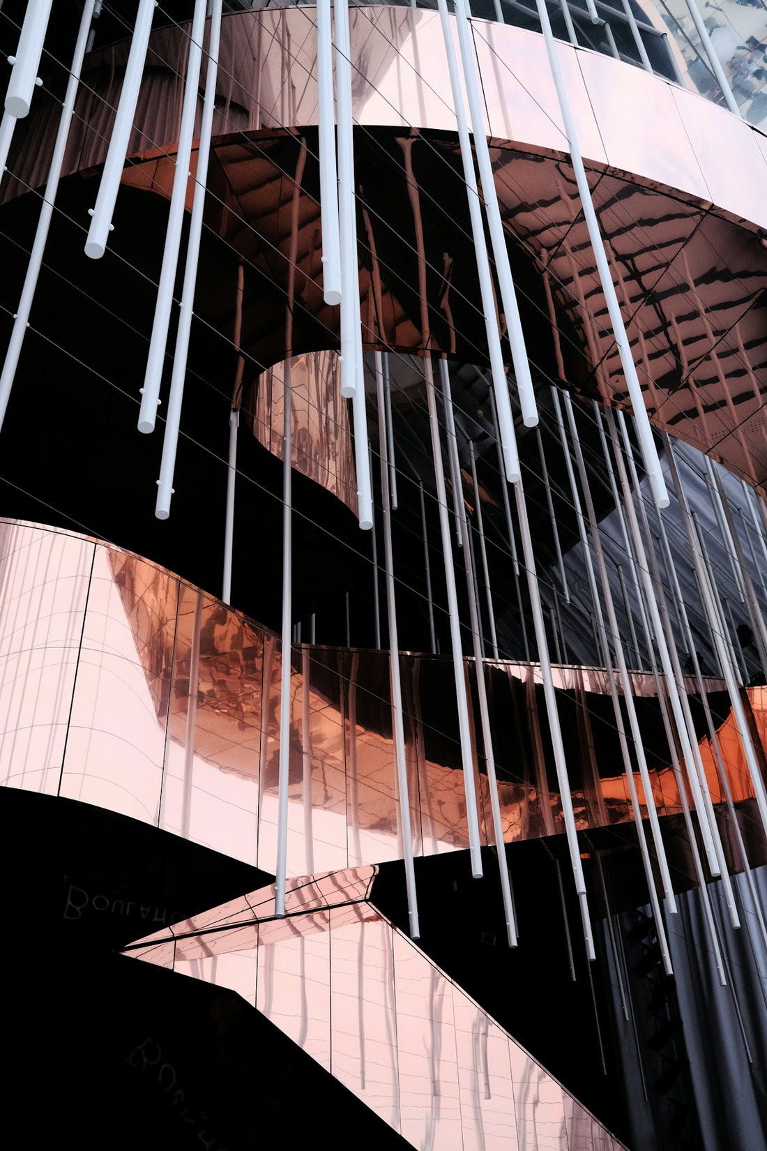 Modern architecture with hanging light structures.