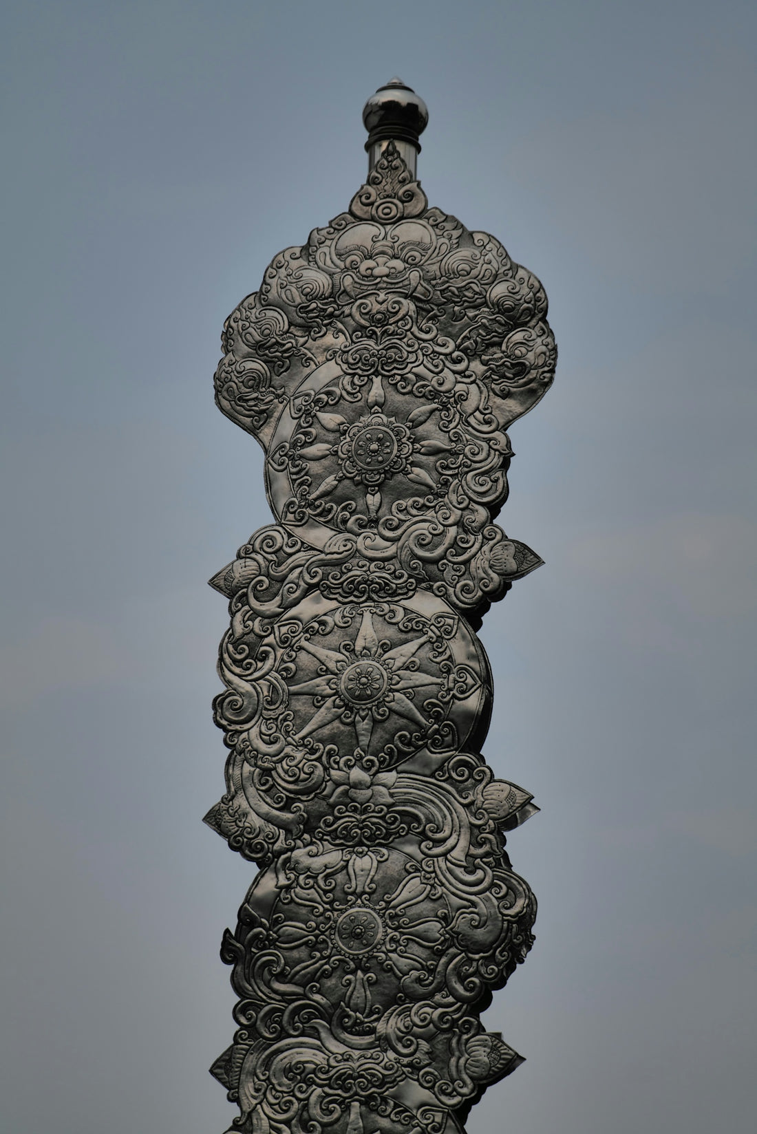An intricate, ornamental pillar stands tall.