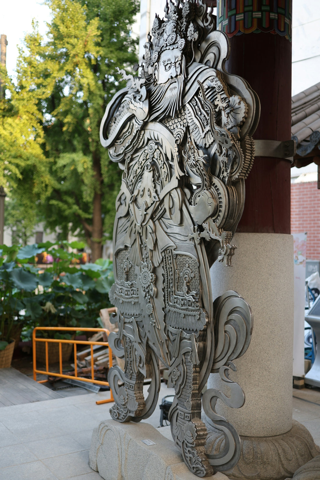 A detailed carving of a traditional asian figure.