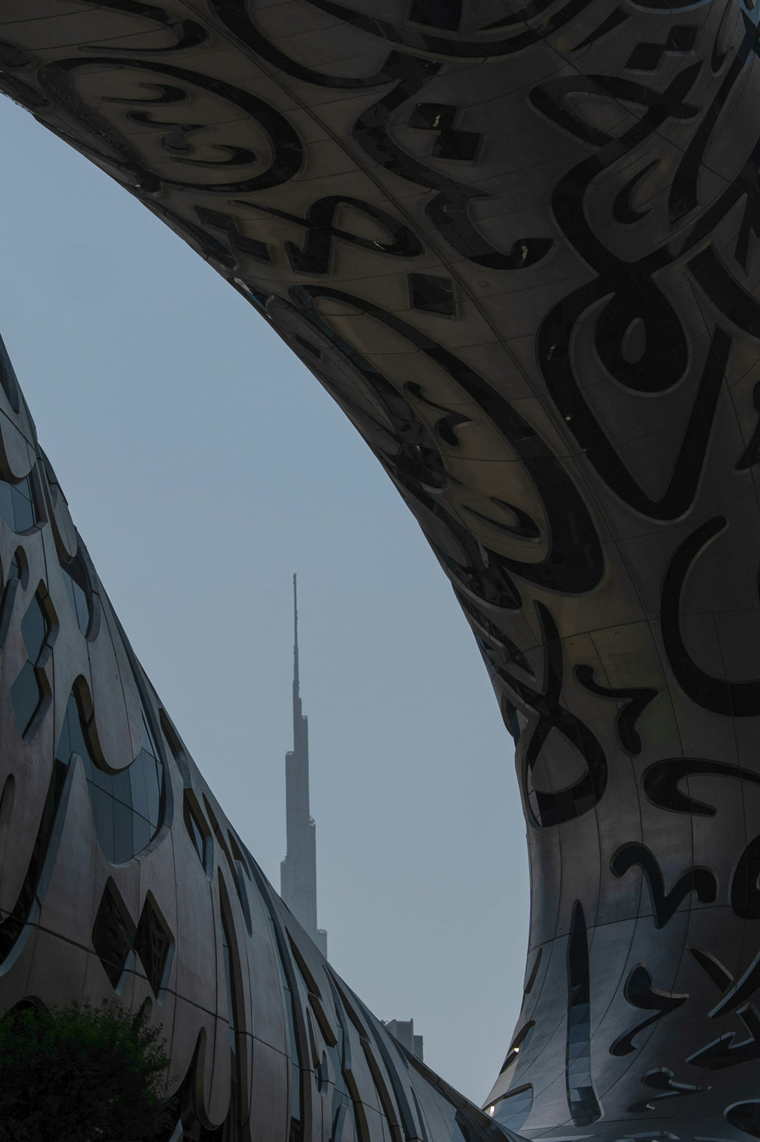 Modern architecture framing a distant skyscraper