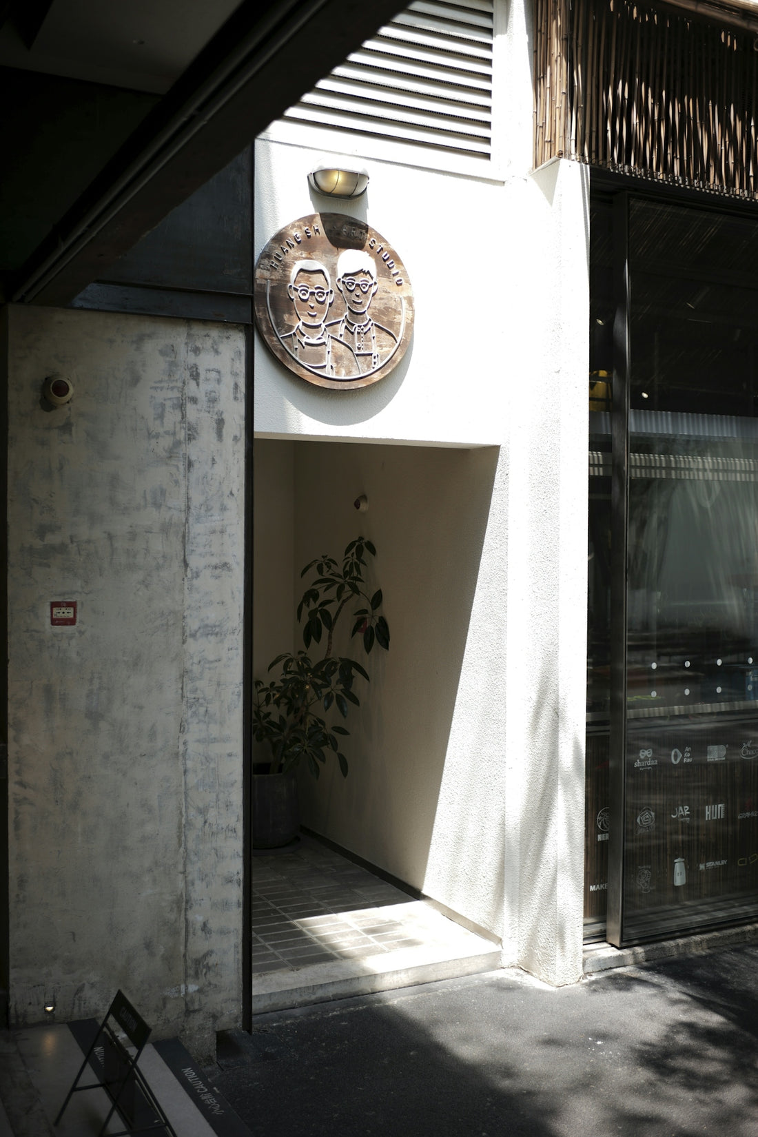 Entrance with a circular plaque above the doorway.