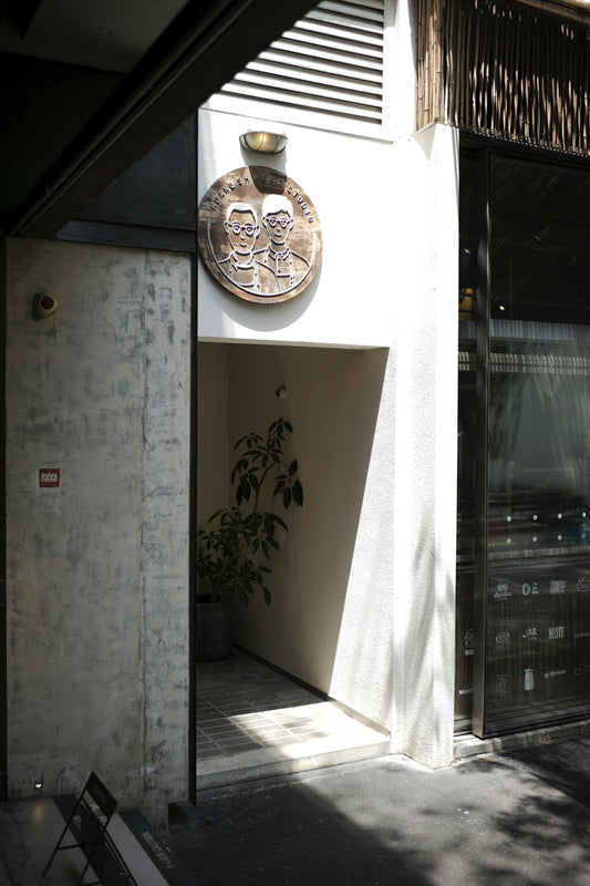Entrance with a circular plaque above the doorway.