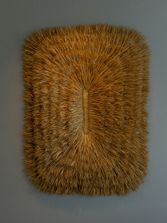 Textured brown mat with central indentation