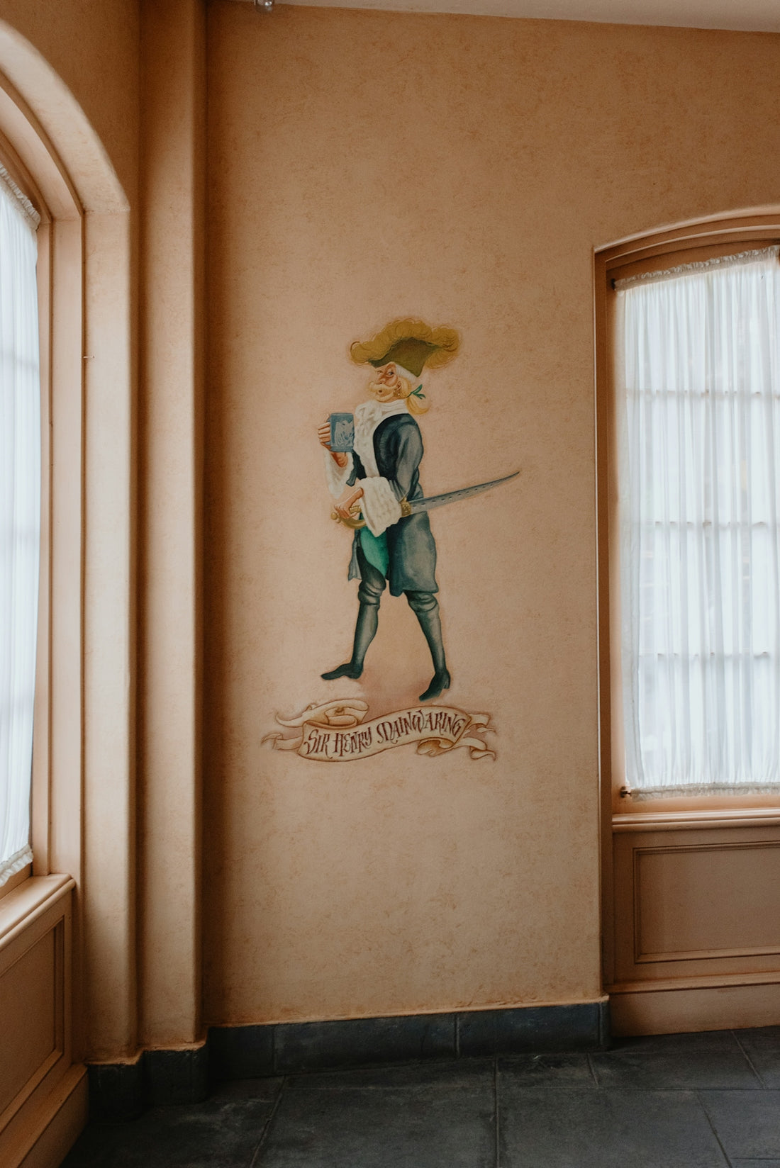 A historical wall painting of a man with a sword.